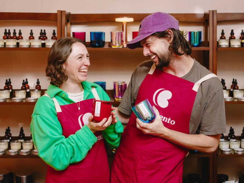 A couple hold their handmade candle gifts