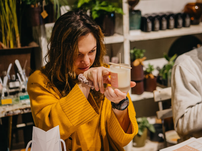 A woman relaxes with a candle making class