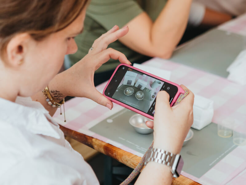 A person practises taking photos on smartphone