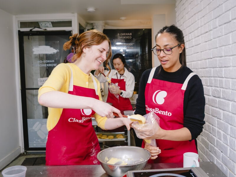 Two friends cook together