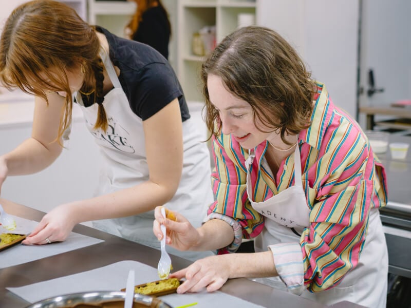A couple making chocolate