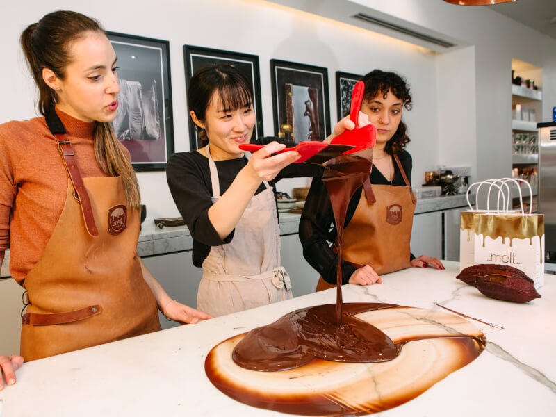 three woman at a chocolate making workshop