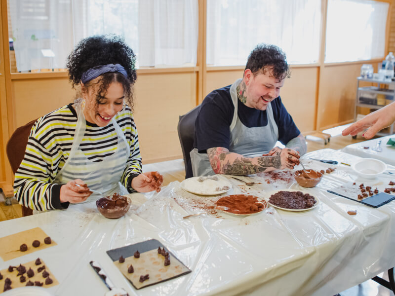 Couple making chocolates together