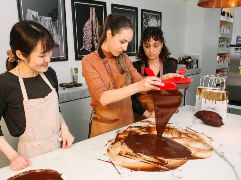 Three friends at a chocolate making class