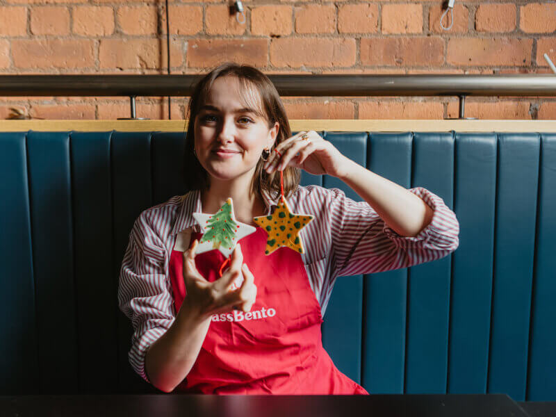 Woman shows off her handmade Christmas ornaments