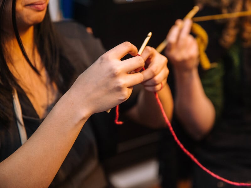 Hands making crochet