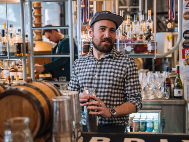 A man shakes cocktails for a celebration