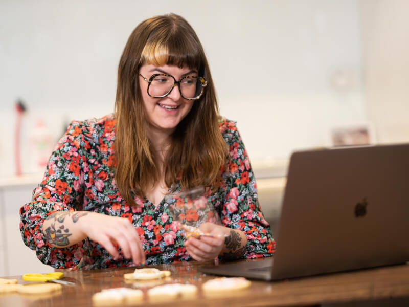 Woman decorating cookies