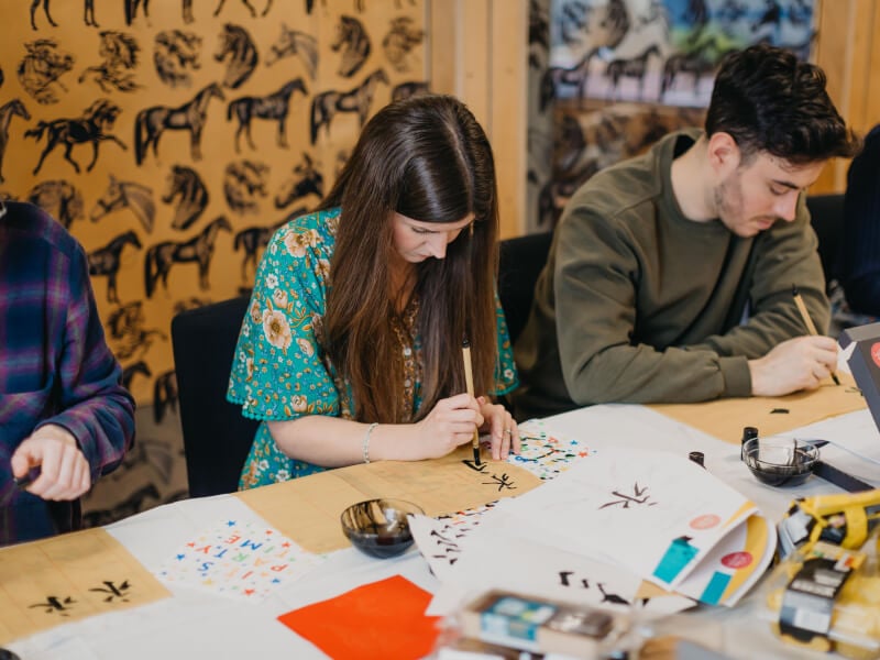 Couple doing an online calligraphy course together