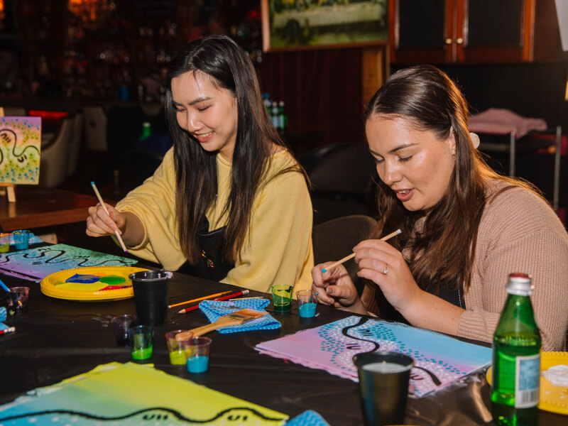 A couple enjoying a painting class