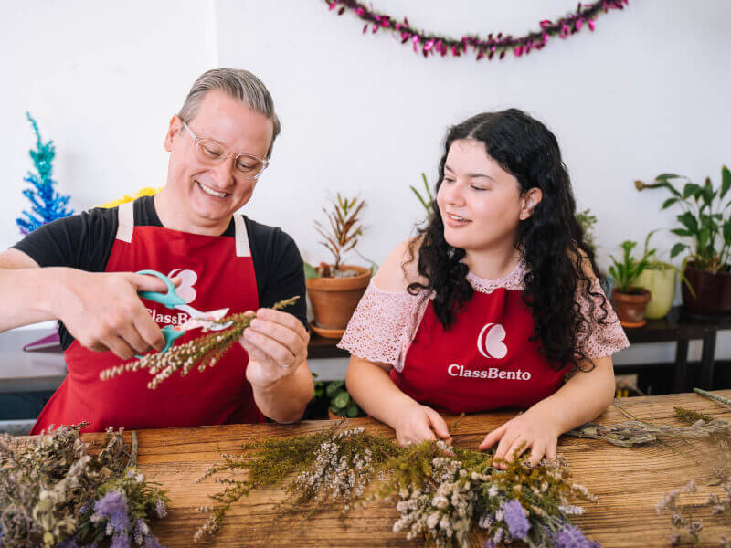 Couple smiling at flower arranging class