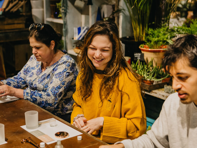 A couple on a date make candles at a workshop