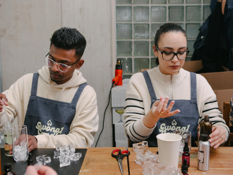 A couple focusing on making candles at their experience gift workshop