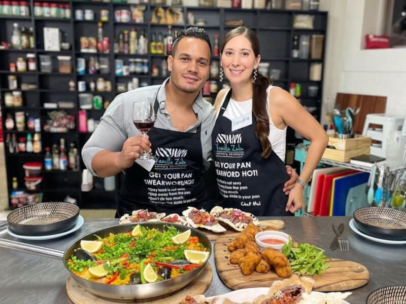 couple posing with handmade dinner