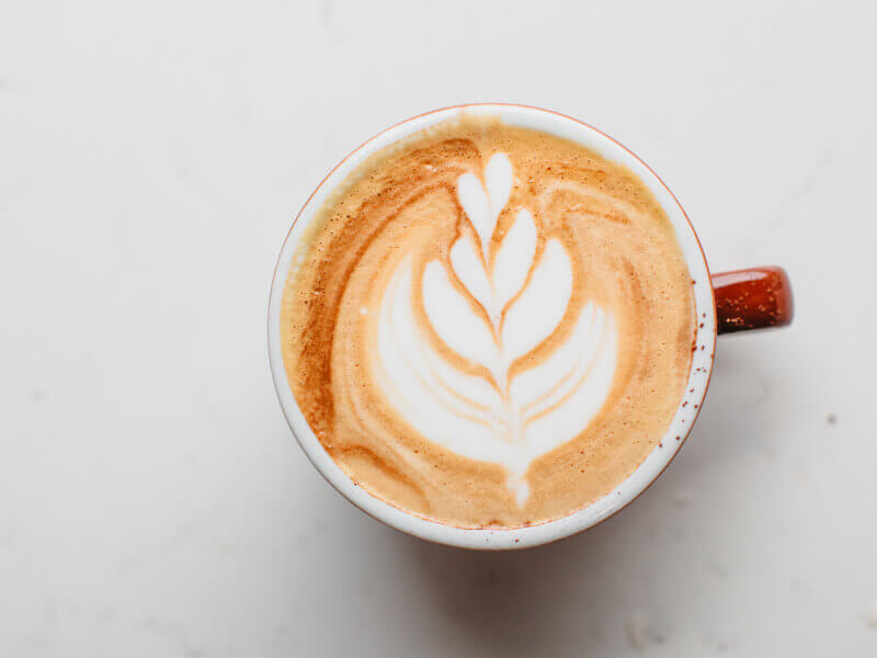A cup of coffee with rosetta latte art