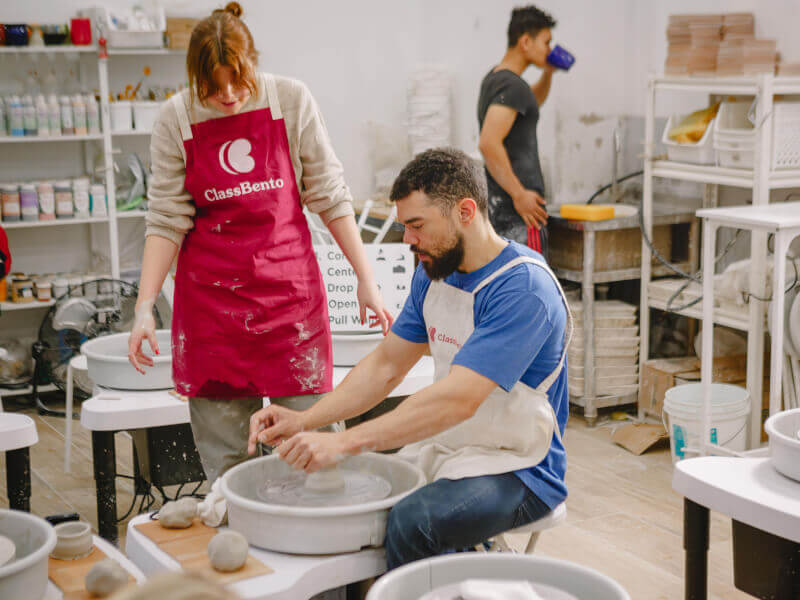 A father and his daughter bond over the pottery wheel