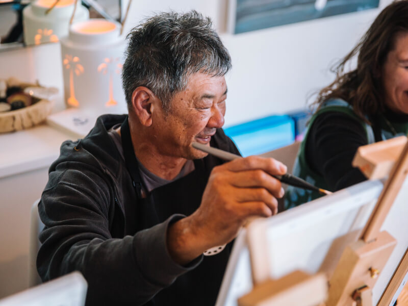 A Dad enjoys a painting class he was gifted