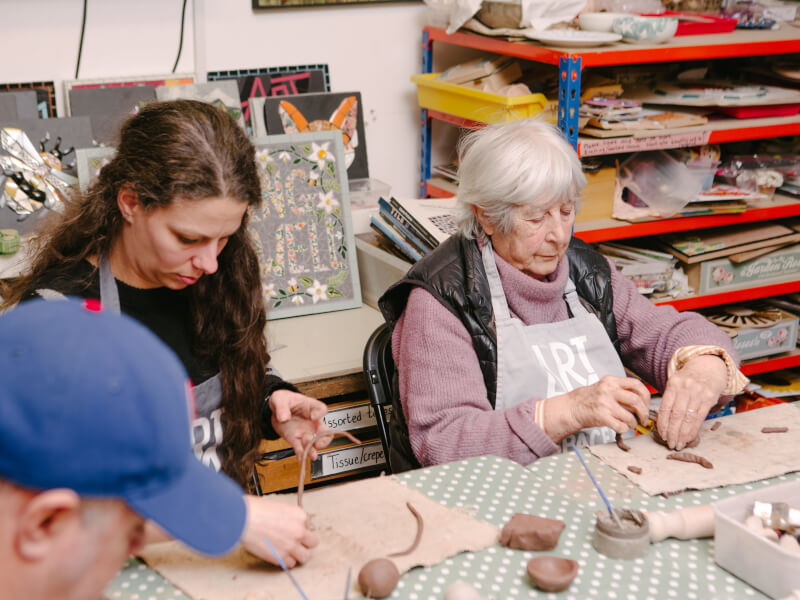 An older woman and her daughter at a hand building class
