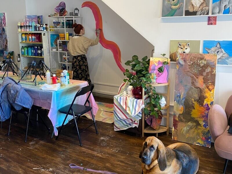 Eloise and her dog in the Paint With Me studio