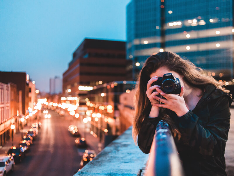 A woman taking photos at a night photography class
