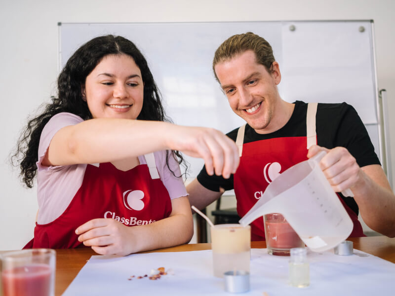 A couple making candles at home