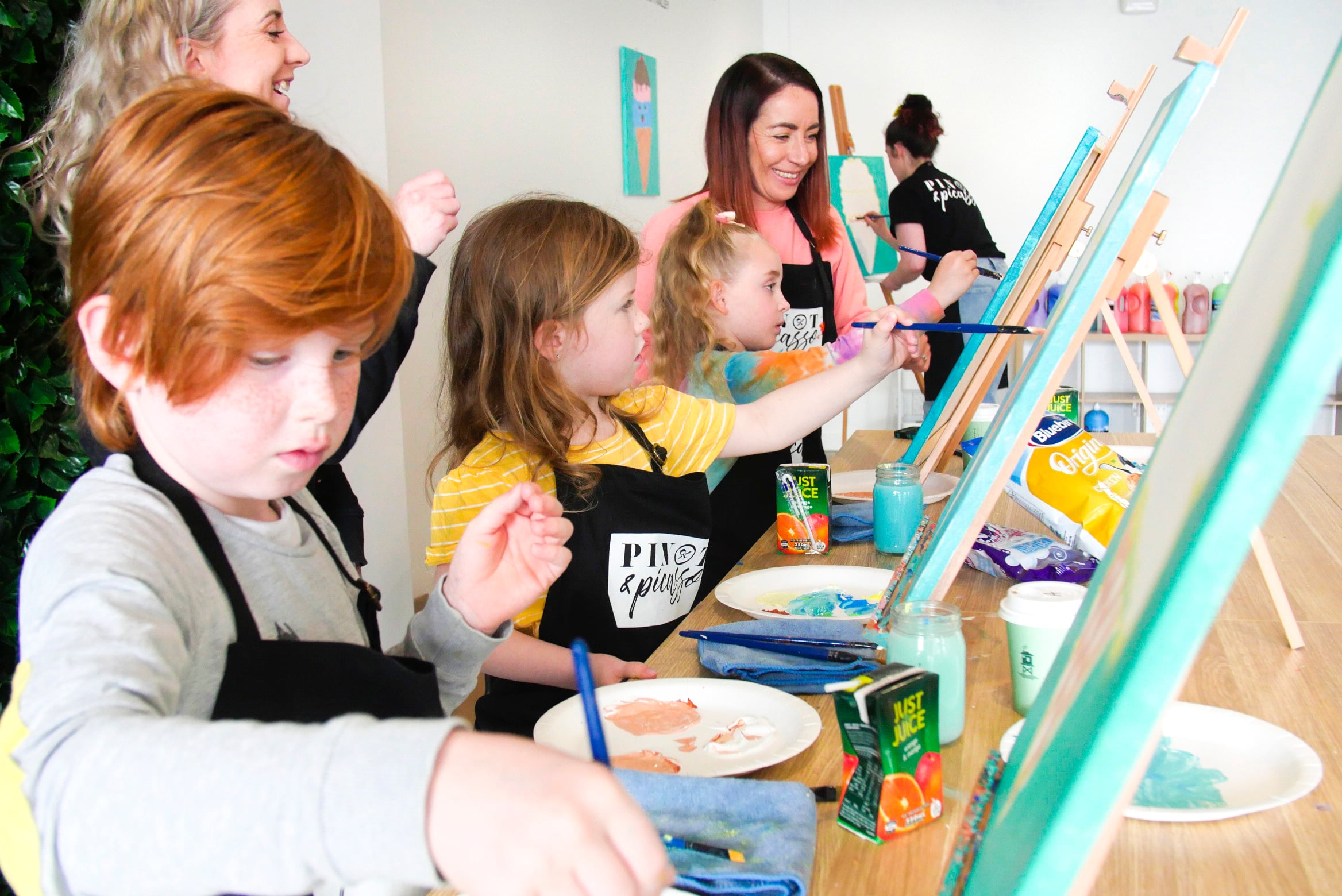 Kids painting side by side