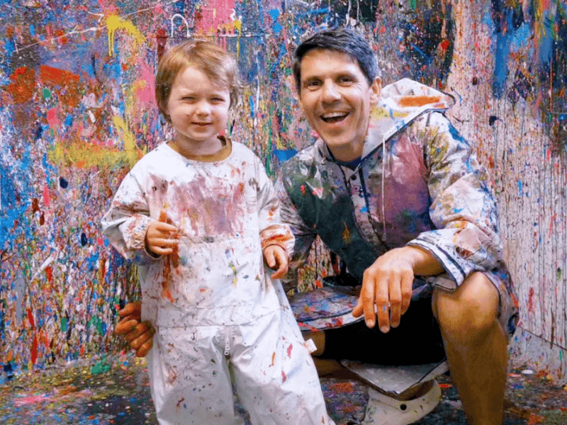 dad and child at fun splatter paint experience