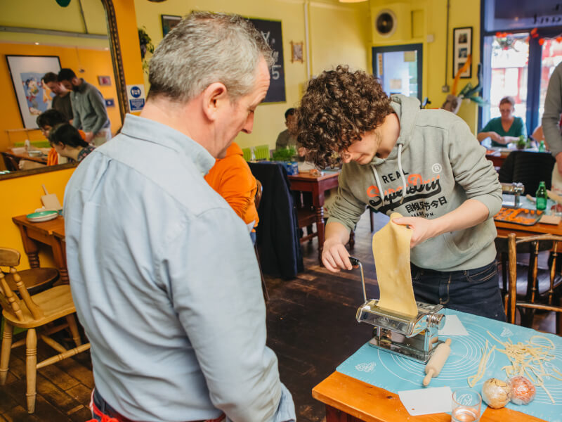 father and son pasta making
