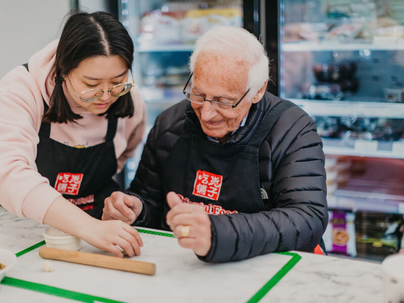 father making dumplings at cooking class