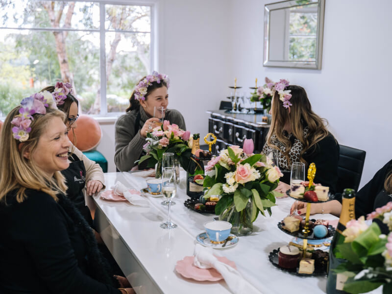 Group of women wearing flower crowns at hens party