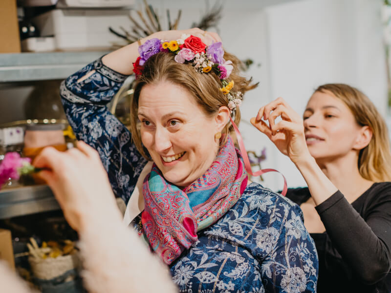 Woman smiling wearing flower crown