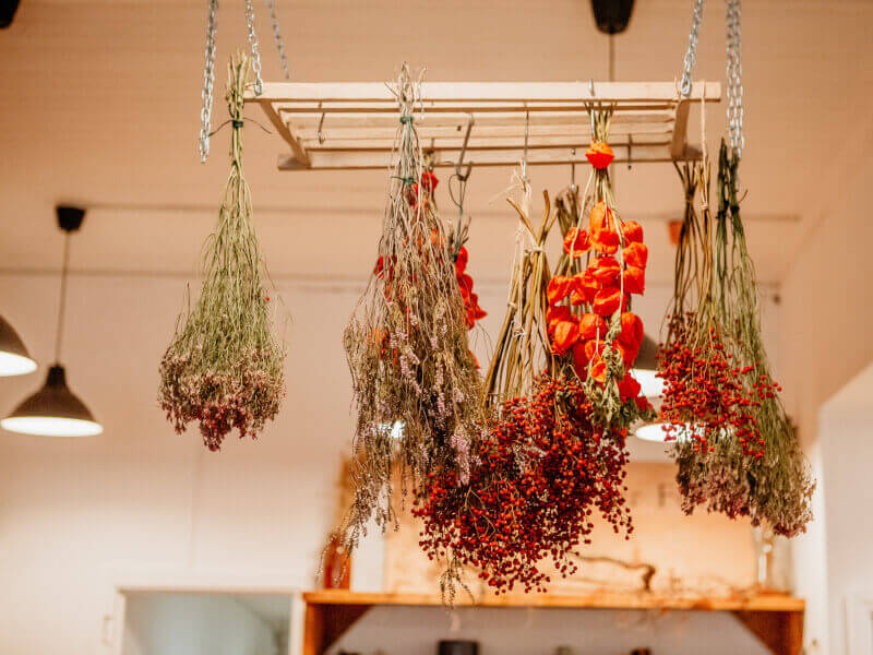 Flower arrangements hanging from ceiling at a floristry studio in Sydney
