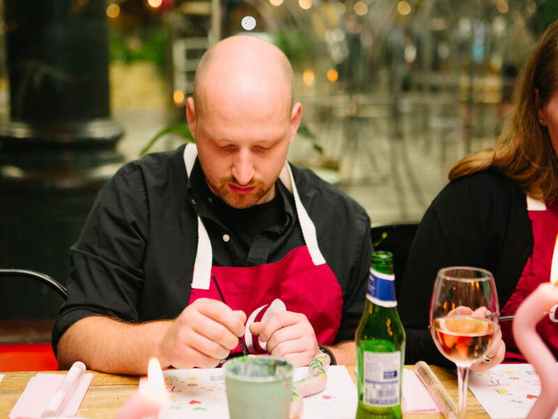 A man focusing on crafts at his gift experience activity