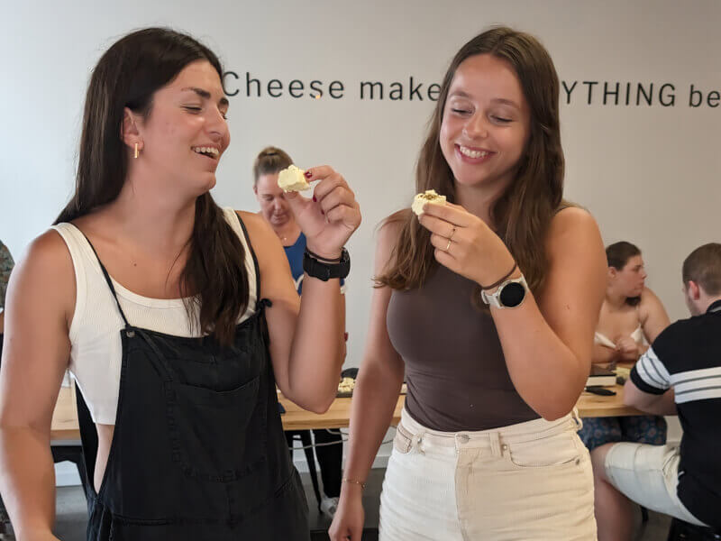 Two friends eating handmade halloumi