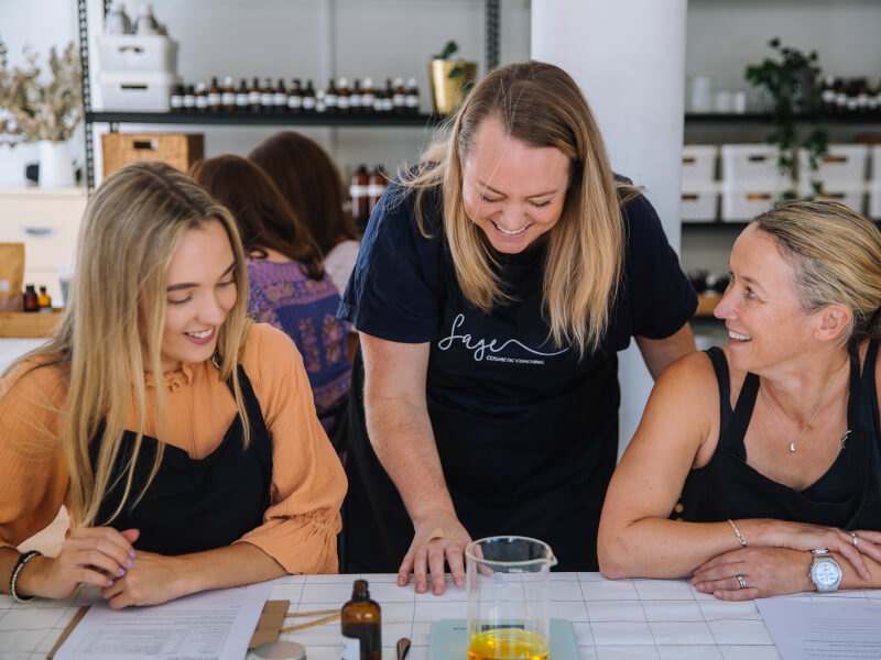 A mother and her daughter make skincare at a gift experience