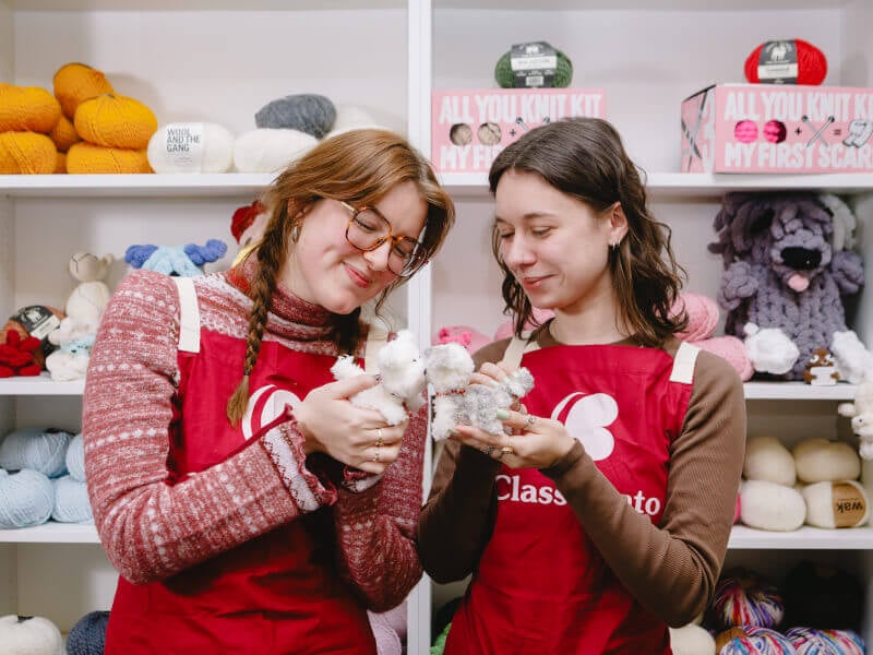 Two friends with their crochet toys