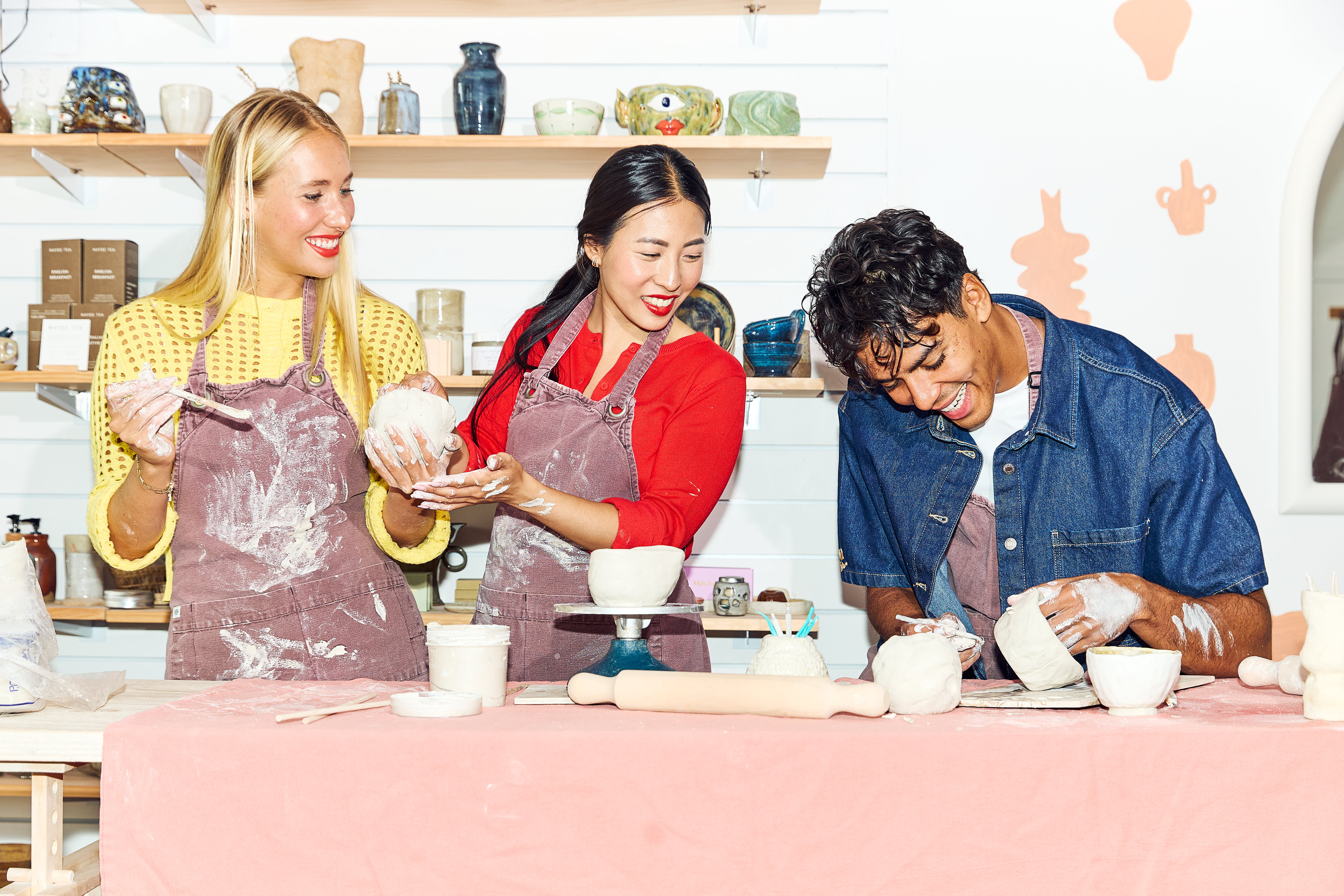 friends happy at a pottery class