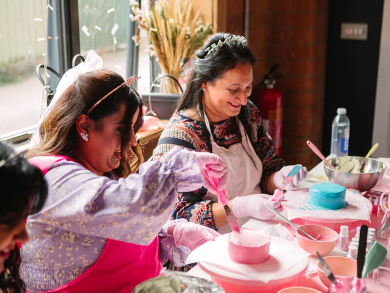 Two friends at a cake decorating class in Sydney