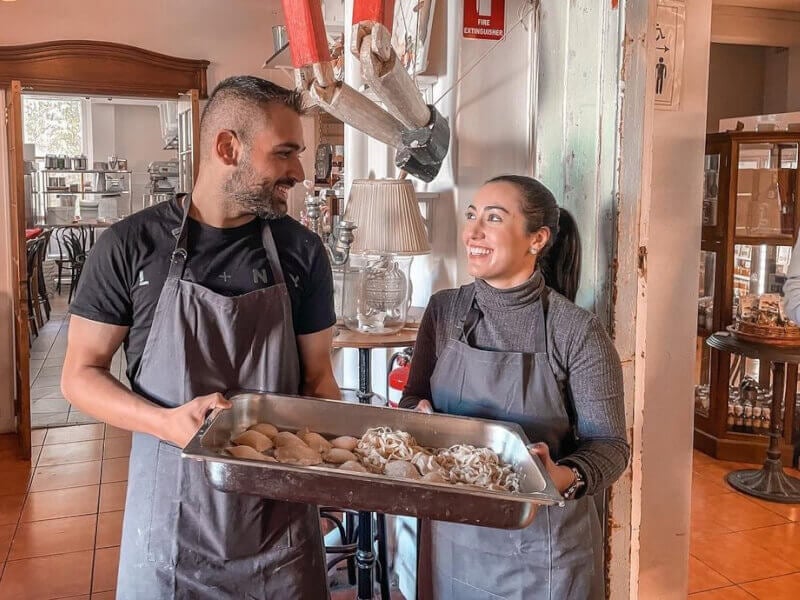 Two people gazing at each other with handmade pasta