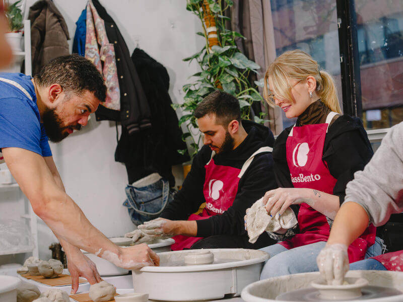 A group celebrates a birthday at a pottery class