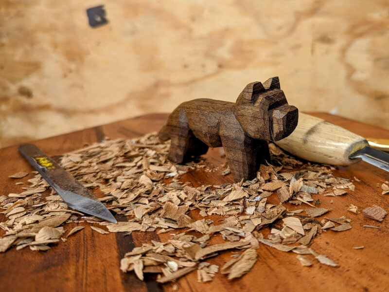 A hand whittled wooden animal figurine for him