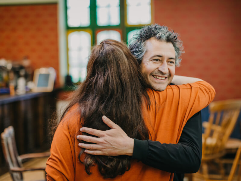 Man hugging a woman