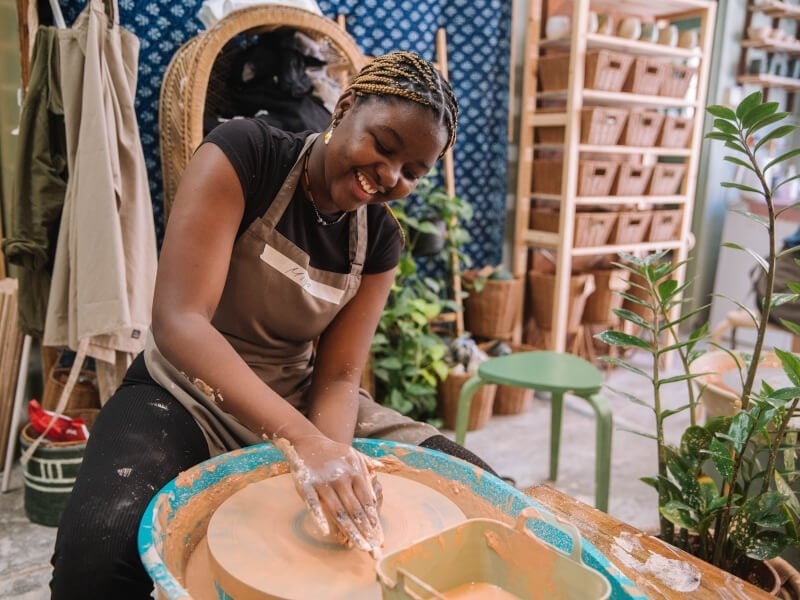 Woman wheel throwing