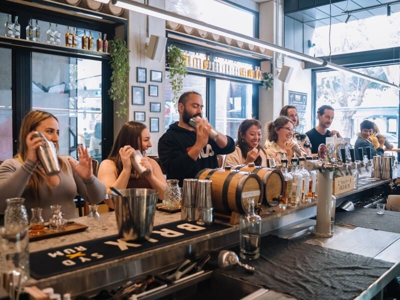 People shaking cocktails