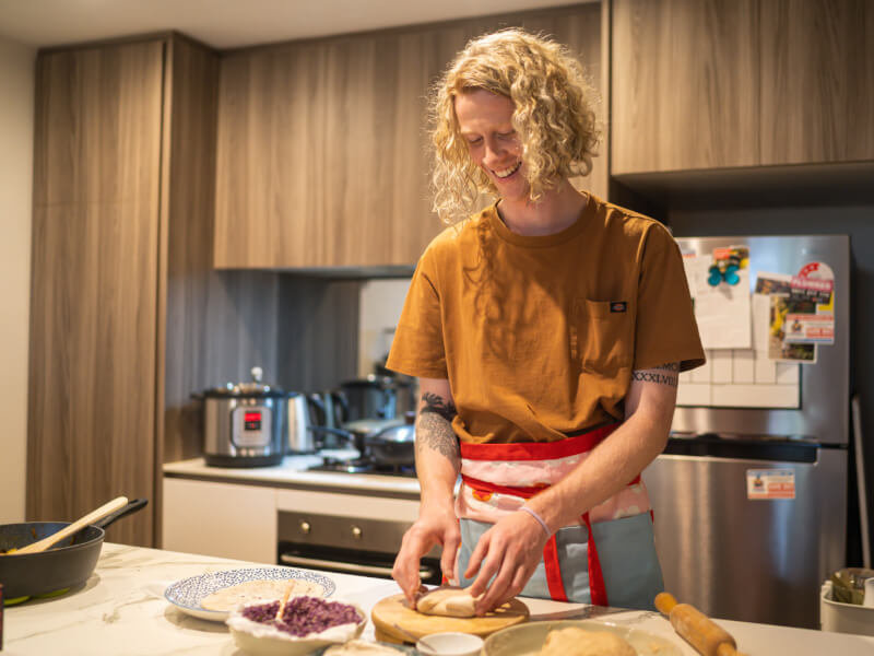 A man preparing food at an Indian cooking class