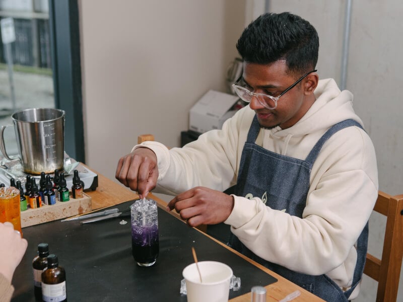A man enjoying the candle making class he was gifted for Valentine's Day