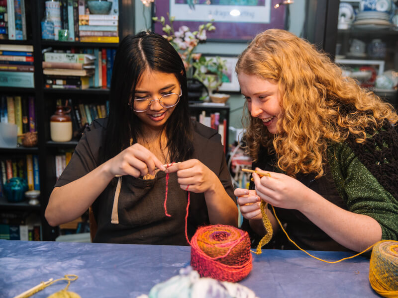 Two friends at a knitting class