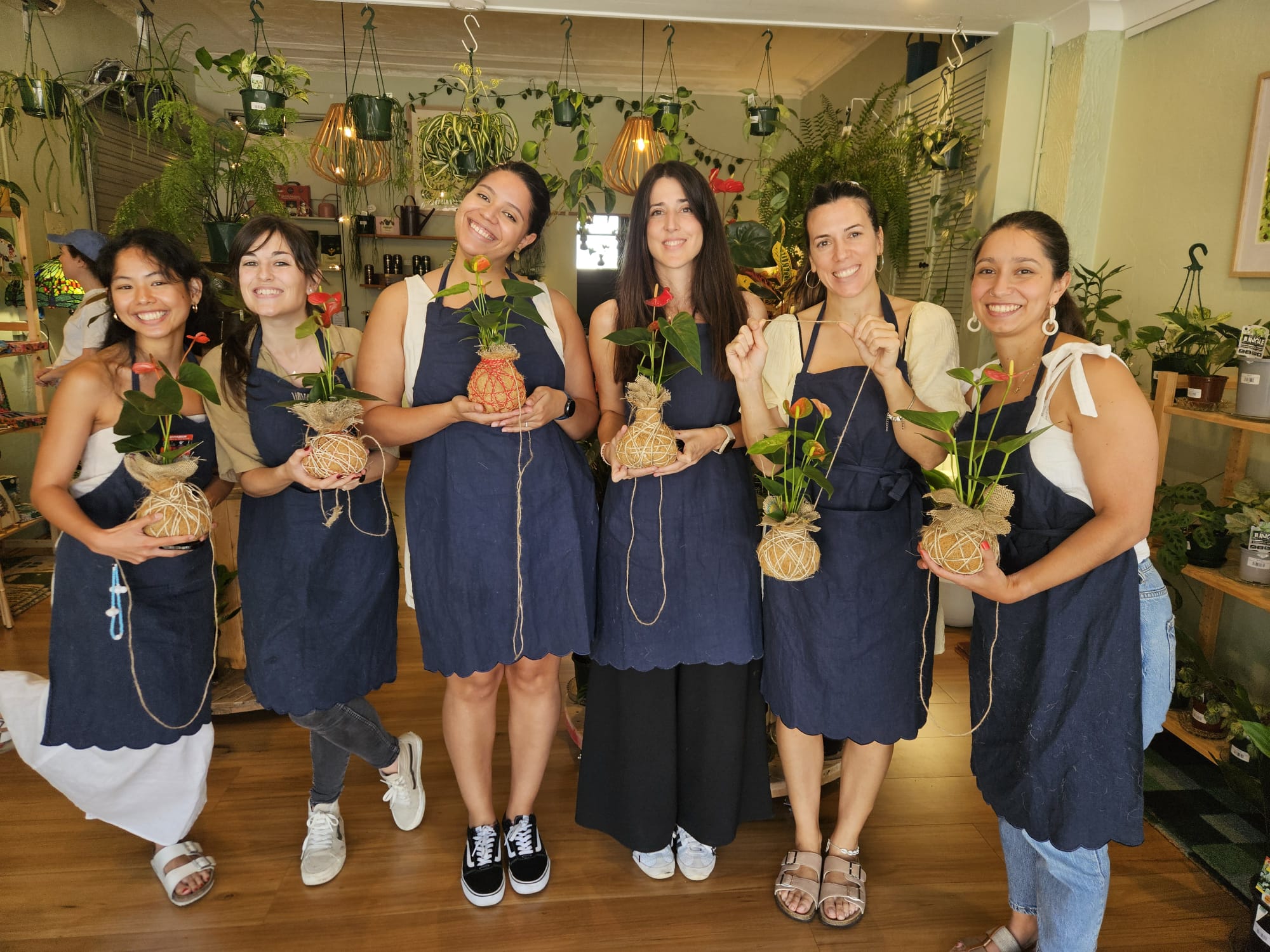 People holding their finished Kokedama plants