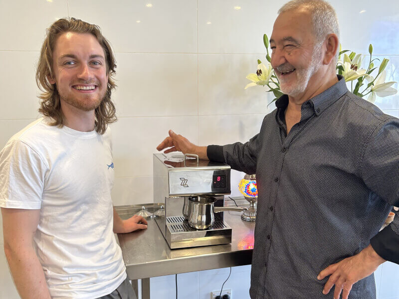 A student and Joseph Atallah laughing together
