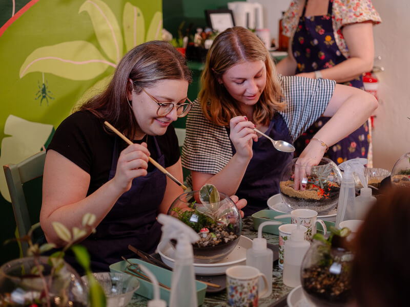 two women at a terrarium making class